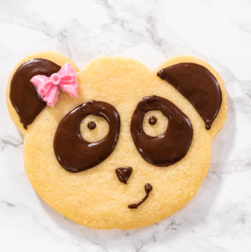 Panda shaped shortbread cookies with chocolate icing - Arina Photography