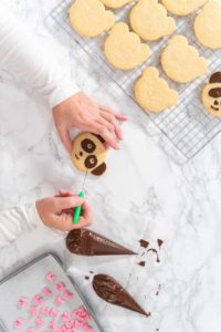 Panda shaped shortbread cookies with chocolate icing - Arina Photography