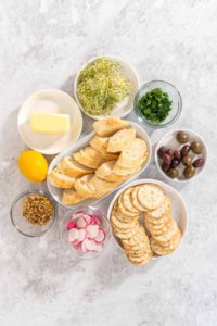 Butter board with vegetables and bread - Arina Photography Flat lay. Measured ingredients in glass mixing bowls to make butter board with vegetables and bread.
