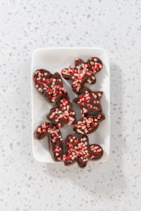 Christmas cookie-cutter peppermint fudge - Arina Photography Flat lay. Freshly made Christmas cookie-cutter peppermint fudge on the serving plate.
