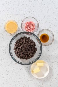Christmas cookie-cutter peppermint fudge - Arina Photography Flat lay. Measured ingredients in glass mixing bowls to make Christmas cookie-cutter peppermint fudge.