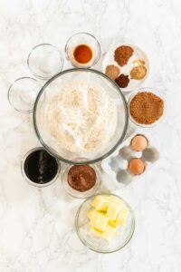 Chocolate Gingerbread Cookie Dough for Holiday Baking - Arina Photography A beautiful arrangement of ingredients for Chocolate Gingerbread Cookie Dough, including flour, butter, brown sugar, molasses, eggs, and a variety of spices. These ingredients are essential for creating rich and festive holiday cookies.