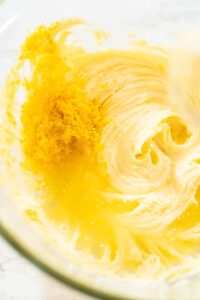 835-05109 - Arina Photography Creamed butter mixture with added lemon zest and juice in a glass bowl for lemon spritz cookie dough.